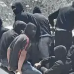 West Bank, hooded Israeli settlers attack Palestinians