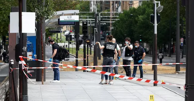 Police officers working at the scene of a knife attack near Porte de Clichy in Paris, France, on July 27, 2026. REUTERS/Abdul Saboor Reuters