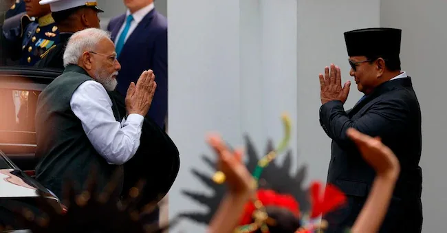 Indian Prime Minister Narendra Modi received in Jakarta by Indonesian President Prabowo Subianto EPA