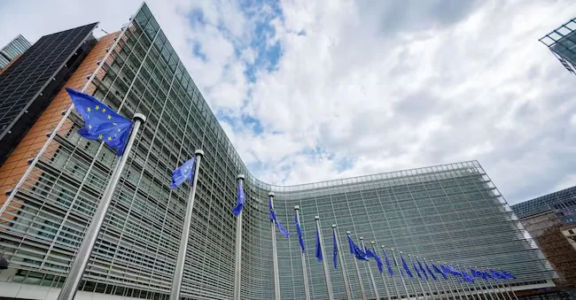European flags wave in front of the European Commission headquarters in Brussels EPA