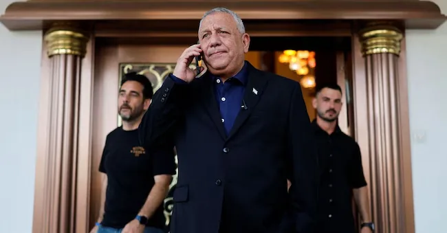 The leader of the Israeli opposition and former head of the Israeli armed forces Gadi Eisenkot speaks on the phone outside a conference organized for his election campaign ahead of the Israeli elections, in Dimona, Israel, July 6, 2026. REUTERS/Amir Cohen REUTERS