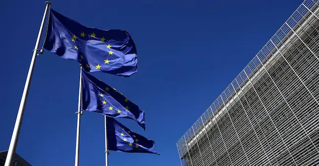 The flags of the European Union waving in front of the Commission headquarters in Brussels (REUTERS) REUTERS