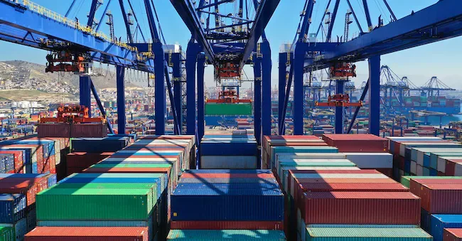 Aerial photo of a logistics terminal during loading and unloading operations of a tanker ship. (Adobe Stock)