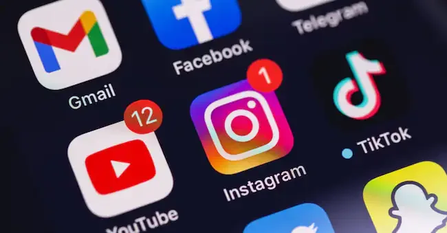 showing social media mobile apps icons of YouTube, Instagram, TikTok on a screen iPhone closeup. Moscow, Russia - November 28, 2020 prima91 - stock.adobe.com