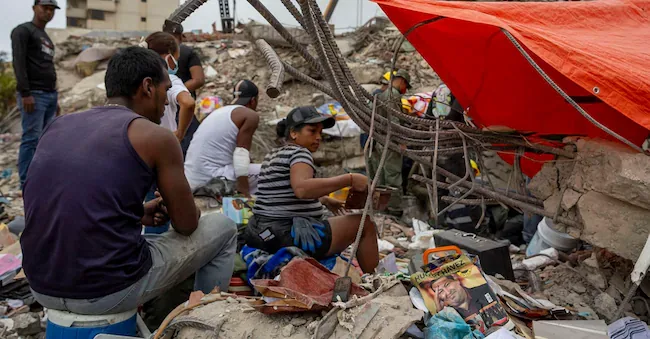 The population set up camps in front of buildings destroyed by the late June earthquakes in Caraballeda, Venezuela, on July 17, 2026. The death toll from the two earthquakes that struck Venezuela on June 24 has risen to 5,069, after the addition of 139 new deaths, according to Parliament President Jorge Rodriguez, who also specified that the number of injured remains at 16,740. EPA/MIGUEL GUTIERREZ EPA