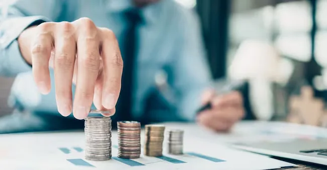Hand putting money coins stack growing, saving money for finance accounting concept. Charnchai saeheng - stock.adobe.com