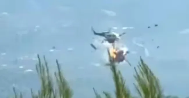 A frame from a video showing the collision between two firefighting helicopters in Greece, near Athens, August 2, 2026. X/ForecastGreece ANSA