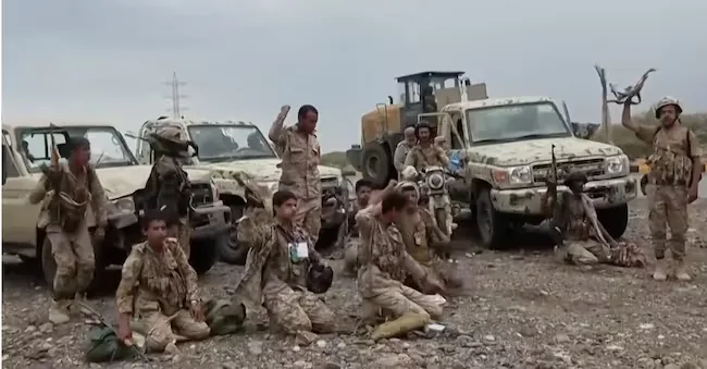 This image, taken from an undated video released on Saturday, September 12, 2026, shows Houthi fighters chanting after praying next to military vehicles during what, according to the group, was their advance against Saudi-backed forces in an unspecified location in southern Yemen. (Ansar Allah Press Office via AP) APN
