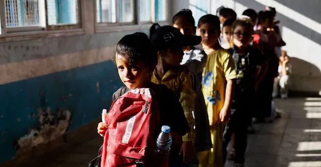 Palestinian students attend the first day of the new school year at an UNRWA school in Nuseirat, central Gaza Strip, on September 19, 2026. REUTERS/Mahmoud Issa REUTERS