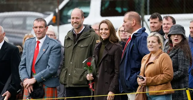 Prince William of England, center left, and Kate, Princess of Wales, watch training activities on the field during a visit to the Bute Shinty Club in Rothesay, as part of a royal visit to the Isle of Bute, Scotland, Thursday, September 17, 2026.  (APN)