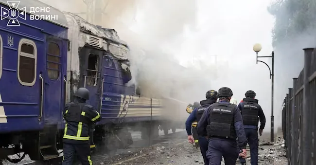 Firefighters extinguish the flames of a passenger train carriage hit by a Russian drone attack at a railway station, in the context of the Russian offensive against Ukraine, in Lutsk, Ukraine, on September 12, 2026. Press office of the State Emergency Service of Ukraine in the Volyn region/Photo provided via REUTERS via REUTERS
