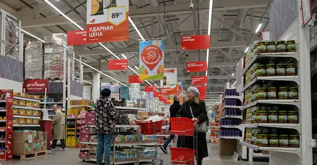 Customers choose food products in a store of the French chain Auchan in Saint Petersburg, Russia, Thursday, October 24, 2024. (AP Photo/Dmitri Lovetsky) AP